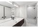 Modern bathroom featuring marble tiling and sleek, dark hardware at 21480 N 56Th Ave, Glendale, AZ 85308