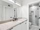 Modern bathroom featuring a marble countertop and sleek, dark hardware at 21480 N 56Th Ave, Glendale, AZ 85308