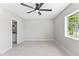 Bedroom featuring ceiling fan and access to the ensuite bathroom at 21480 N 56Th Ave, Glendale, AZ 85308