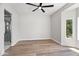 Cozy bedroom with ensuite bathroom, a ceiling fan, and ample natural light at 21480 N 56Th Ave, Glendale, AZ 85308