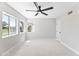 Bedroom featuring a ceiling fan and several windows at 21480 N 56Th Ave, Glendale, AZ 85308