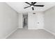 Neutral bedroom featuring ceiling fan and open access to the bathroom at 21480 N 56Th Ave, Glendale, AZ 85308