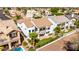 An aerial view of the back of a two-story house with a manicured yard and mature landscaping at 21480 N 56Th Ave, Glendale, AZ 85308