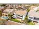 Aerial view of the back of a two-story home with a manicured lawn in a lakeside community at 21480 N 56Th Ave, Glendale, AZ 85308