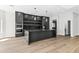 Bright kitchen features a black island, ample cabinet space, and modern fixtures at 21480 N 56Th Ave, Glendale, AZ 85308