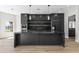 Elegant kitchen features black marble island, modern lighting, and top-of-the-line appliances at 21480 N 56Th Ave, Glendale, AZ 85308