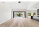 Bright living area with an open balcony overlooking the water and a sleek, modern kitchen at 21480 N 56Th Ave, Glendale, AZ 85308