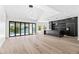 Open living space features wood floors, lake views, black marble kitchen island and cabinetry at 21480 N 56Th Ave, Glendale, AZ 85308