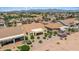 Panoramic aerial view of a desert community showcasing tile roofs, landscaped yards, and mountain views in the distance at 2163 N 164Th Dr, Goodyear, AZ 85395