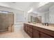 Bright bathroom featuring a double vanity, soaking tub, and separate shower for a spa-like experience at 2163 N 164Th Dr, Goodyear, AZ 85395