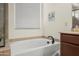 Close-up of the soaking tub with black fixtures in the bathroom at 2163 N 164Th Dr, Goodyear, AZ 85395