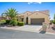 Charming single-story home featuring desert landscaping, a tile roof, and a two-car garage at 2163 N 164Th Dr, Goodyear, AZ 85395