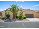 Inviting single-story home with well-maintained landscaping and desert features on a sunny day at 2163 N 164Th Dr, Goodyear, AZ 85395
