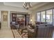 Comfortable living room with a large media center, leather seating, and scenic outdoor views at 2163 N 164Th Dr, Goodyear, AZ 85395