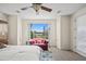 Bright and spacious bedroom with a seating area and abundant natural light at 2163 N 164Th Dr, Goodyear, AZ 85395