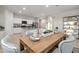 Eat-in kitchen featuring a dining table and view of the modern kitchen at 22650 N Lynn St, Maricopa, AZ 85138