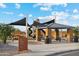 Community park with playground equipment, shaded picnic areas and accessible walking path, and Red River Park signage at 22650 N Lynn St, Maricopa, AZ 85138