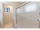 Bathroom featuring a tiled shower and updated fixtures at 2541 N 86Th Ave, Phoenix, AZ 85037
