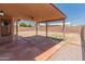 Large covered patio overlooking the spacious, well-maintained backyard at 2541 N 86Th Ave, Phoenix, AZ 85037
