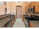Traditional kitchen featuring wooden cabinets, stainless steel appliances, and neutral countertops at 2541 N 86Th Ave, Phoenix, AZ 85037