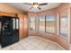 Eat-in kitchen area boasting natural light, black refrigerator and ample cabinet space at 2541 N 86Th Ave, Phoenix, AZ 85037