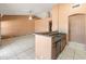 Well-designed kitchen with peninsula, sink and tile flooring at 2541 N 86Th Ave, Phoenix, AZ 85037