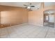 Spacious living room with tile flooring, neutral walls and a ceiling fan at 2541 N 86Th Ave, Phoenix, AZ 85037
