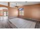 Bright living room area with large windows and arched doorway at 2541 N 86Th Ave, Phoenix, AZ 85037