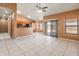 Open-concept living room with tile floors, seamlessly connecting to the kitchen at 2541 N 86Th Ave, Phoenix, AZ 85037