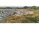 Aerial view of the Primary-planned community surrounded by mountains at 27358 N 69Th Dr, Peoria, AZ 85383