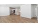 Open-concept floor plan showcases wood-look tile flooring and a seamless transition to the kitchen at 27358 N 69Th Dr, Peoria, AZ 85383