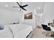Comfortable bedroom with ensuite bathroom, ceiling fan, and a dedicated desk area at 3034 N 39Th St # 12, Phoenix, AZ 85018