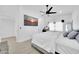 Serene bedroom featuring a ceiling fan, a television, and a comfortable queen size bed at 3034 N 39Th St # 12, Phoenix, AZ 85018
