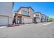 Inviting two-story townhome showcasing a private garage and well-maintained landscaping at 3034 N 39Th St # 12, Phoenix, AZ 85018