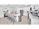 Modern kitchen with white cabinets, stainless steel appliances, and breakfast bar seating at 3034 N 39Th St # 12, Phoenix, AZ 85018