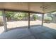 Covered patio offers a view of the yard with block wall at 310 E Payton St, San Tan Valley, AZ 85140