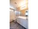 Bright bathroom featuring white vanity with large mirror and a shower-tub combo at 310 E Payton St, San Tan Valley, AZ 85140