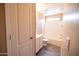 Simple bathroom featuring a shower-tub combo, vanity and linoleum floors at 310 E Payton St, San Tan Valley, AZ 85140