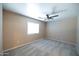 Neutral bedroom featuring carpet and ceiling fan at 310 E Payton St, San Tan Valley, AZ 85140