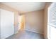 Bedroom with carpet, a closet and neutral paint at 310 E Payton St, San Tan Valley, AZ 85140