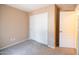 Cozy bedroom with carpet, a closet, and white trim at 310 E Payton St, San Tan Valley, AZ 85140