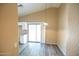 Dining area featuring sleek laminate floors, neutral walls, and access to the backyard at 310 E Payton St, San Tan Valley, AZ 85140