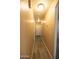 Long hallway with light colored floors and neutral colored walls at 310 E Payton St, San Tan Valley, AZ 85140