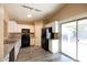 Modern kitchen featuring granite counters, sleek appliances, and ample cabinet space at 310 E Payton St, San Tan Valley, AZ 85140