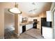 Modern kitchen featuring granite counters, sleek appliances, and ample cabinet space at 310 E Payton St, San Tan Valley, AZ 85140
