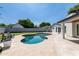 Inviting backyard featuring a pool, well-manicured lawn, and a modern home at 3102 E Mariposa St, Phoenix, AZ 85016