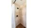 Bathroom shower featuring updated shower-head and stone tile walls at 3102 E Mariposa St, Phoenix, AZ 85016