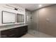 Modern bathroom featuring dual vessel sinks, sleek cabinets, and a glass-enclosed shower at 3102 E Mariposa St, Phoenix, AZ 85016