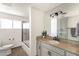 Bathroom with a shower, vanity and toilet features neutral finishes and natural light at 3102 E Mariposa St, Phoenix, AZ 85016