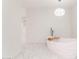 Elegant free-standing bathtub with modern fixtures, and a view of the closet space at 3102 E Mariposa St, Phoenix, AZ 85016